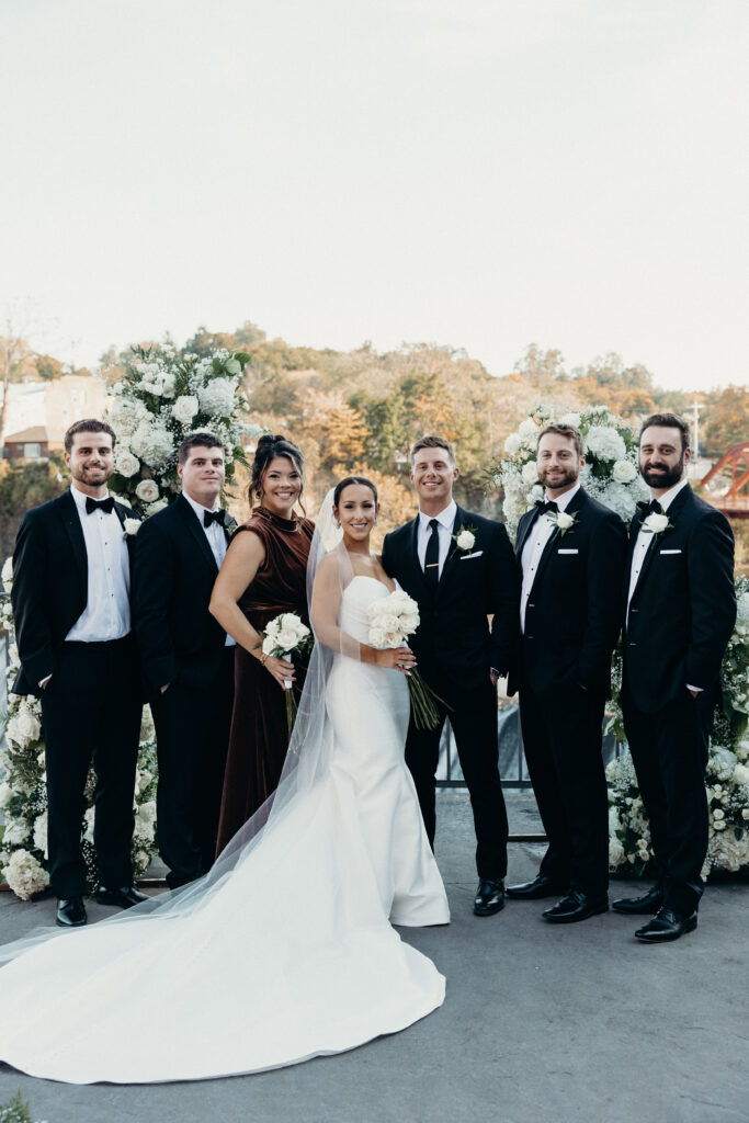 Couple with family photographed by brooklyn wedding photographer at diamond mills