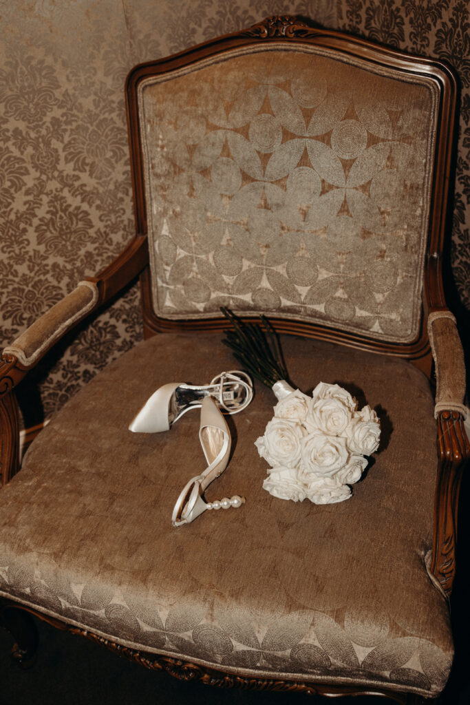 Bridal shoes and bouquet photographed by brooklyn wedding photographer at diamond mills