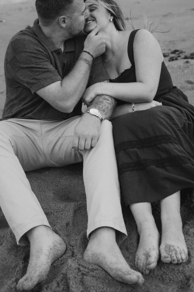 Engaged couple photographed at jersey shore by a brooklyn wedding photographer