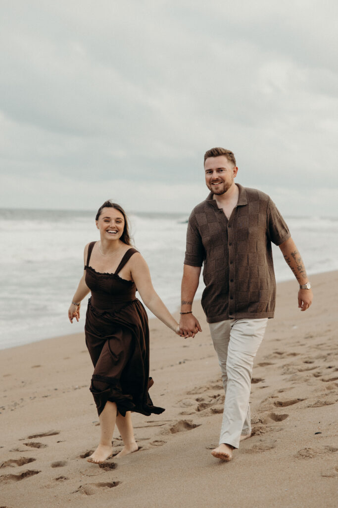 Engaged couple photographed at jersey shore by a brooklyn wedding photographer