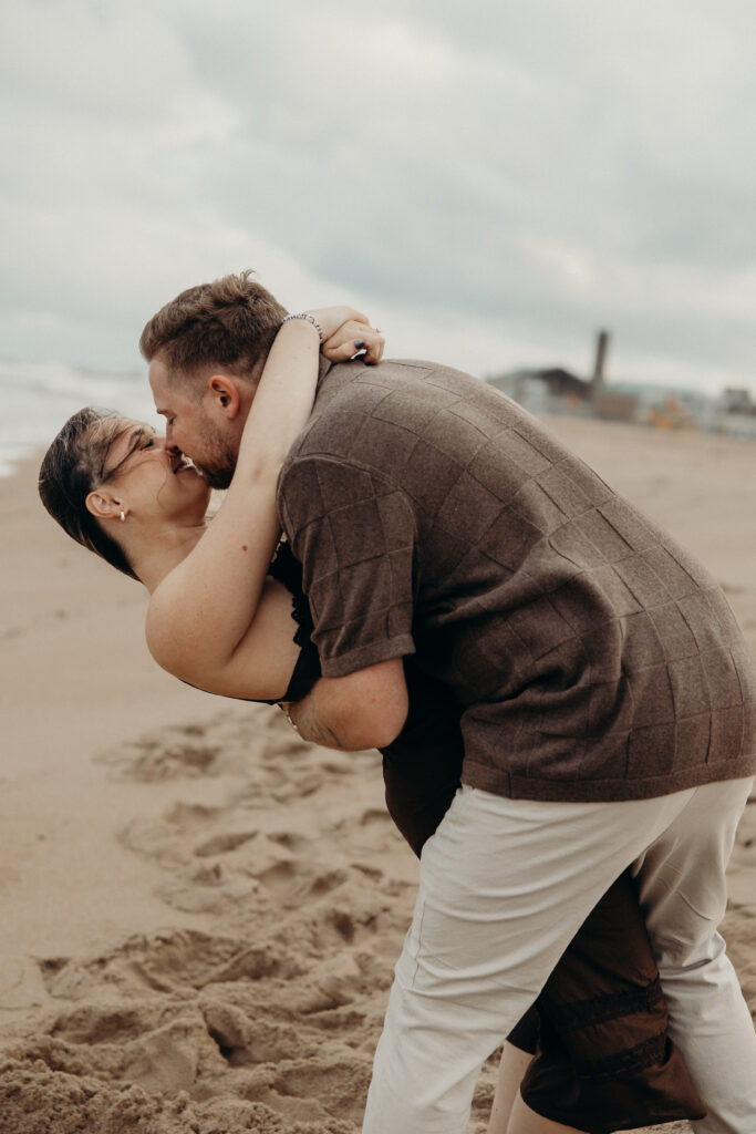 Engaged couple photographed at jersey shore by a brooklyn wedding photographer