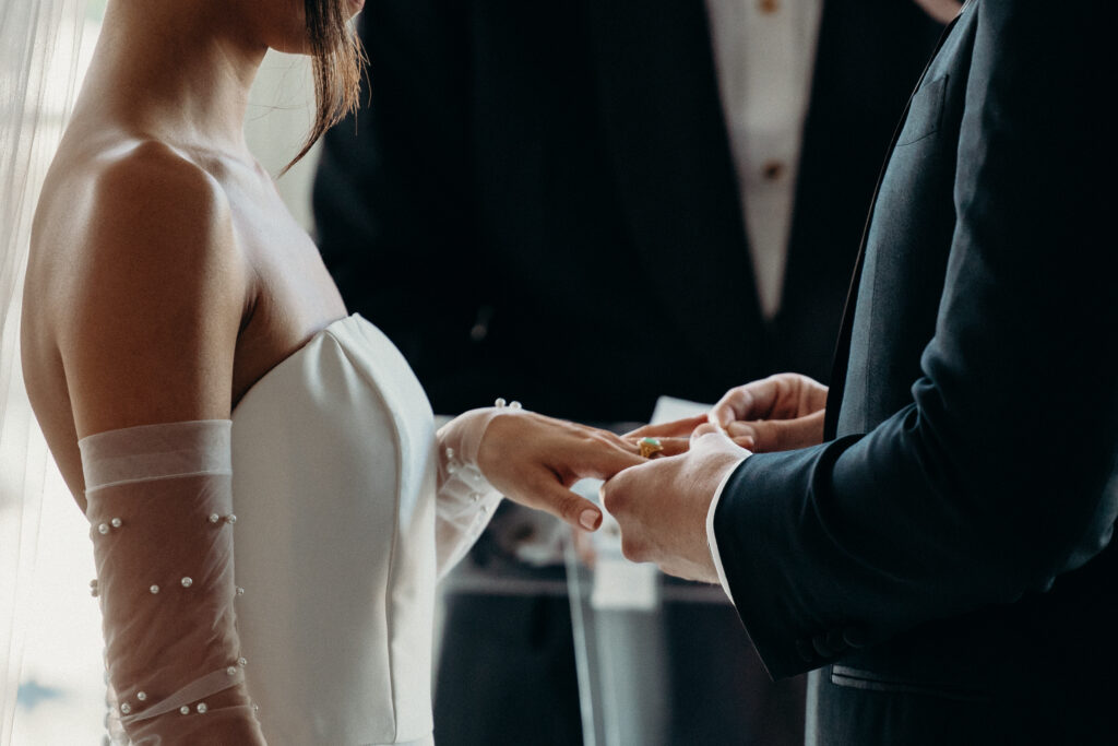 Bride and groom exchange rings at jersey city wedding venue maritime parc