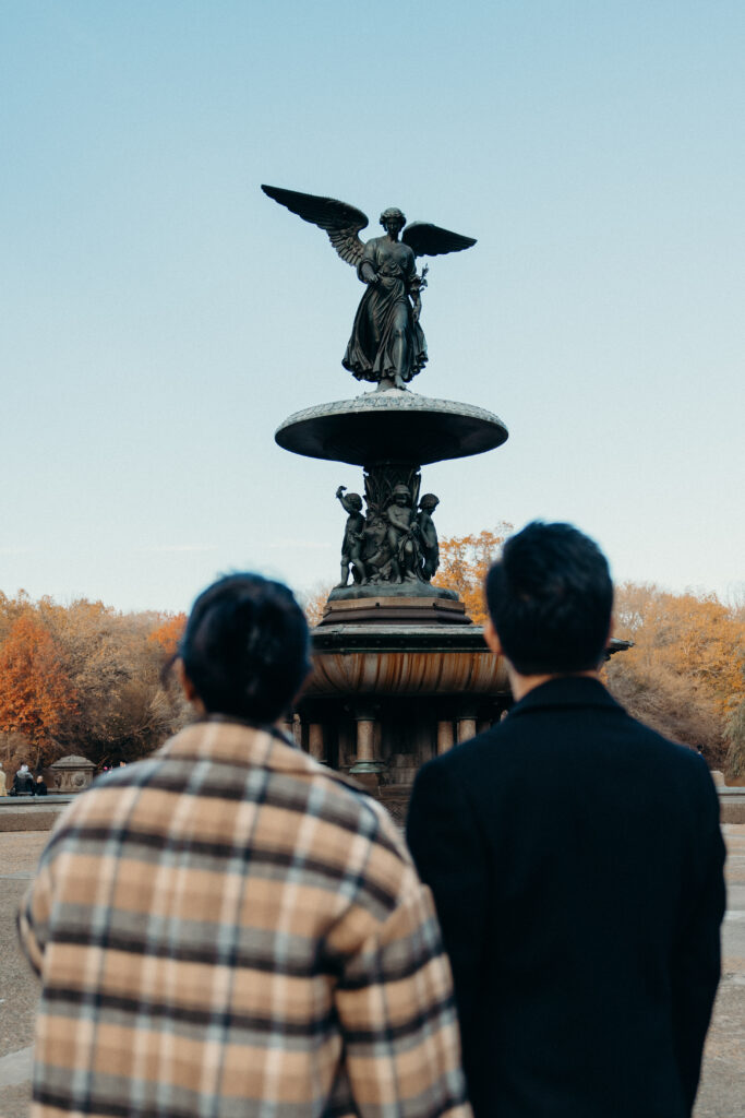 Engaged couple photographed at central park by a brooklyn wedding photographer