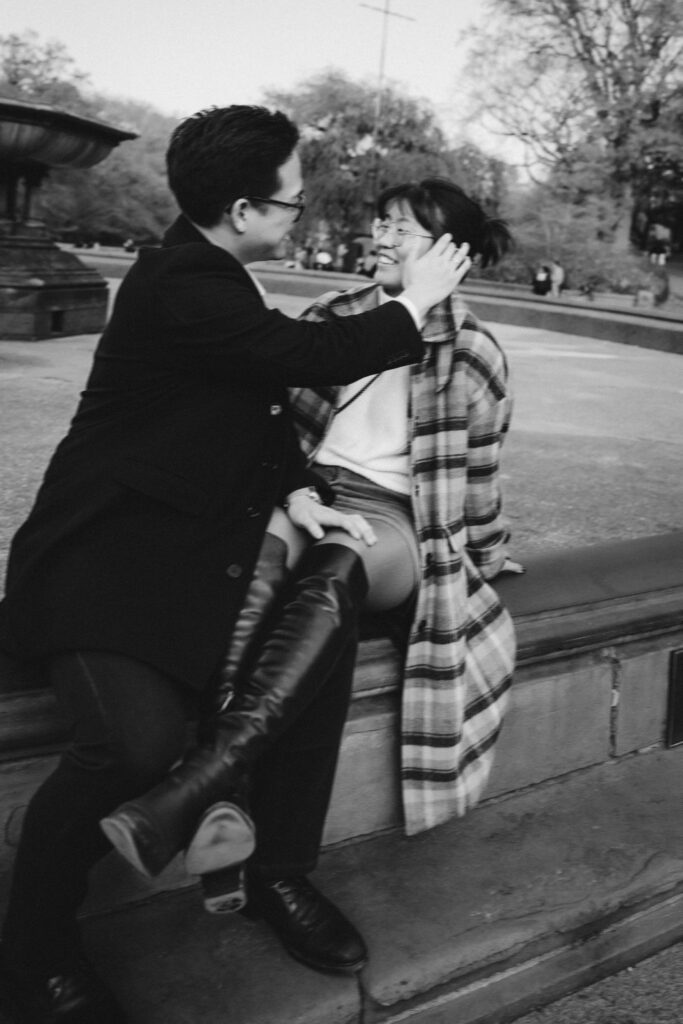 Engaged couple photographed at central park by a brooklyn wedding photographer