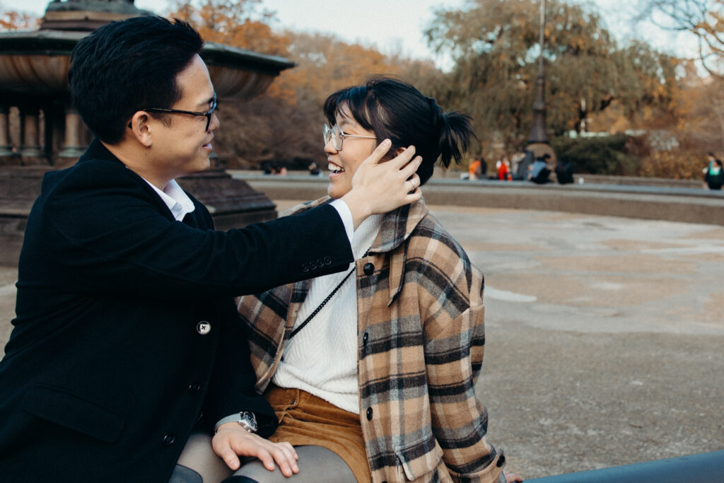 Engaged couple photographed at central park by a brooklyn wedding photographer