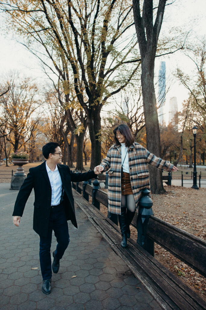 Engaged couple photographed at central park by a brooklyn wedding photographer