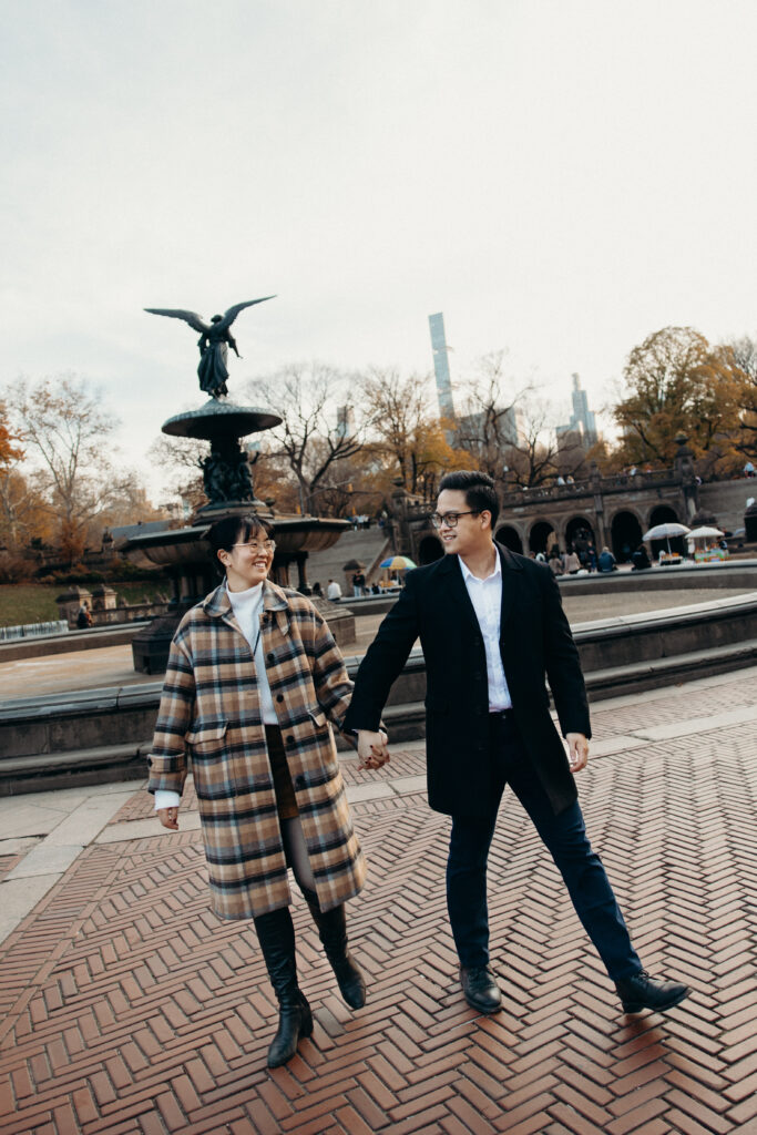 Engaged couple photographed at central park by a brooklyn wedding photographer