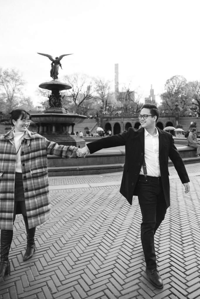 Engaged couple photographed at central park by a brooklyn wedding photographer