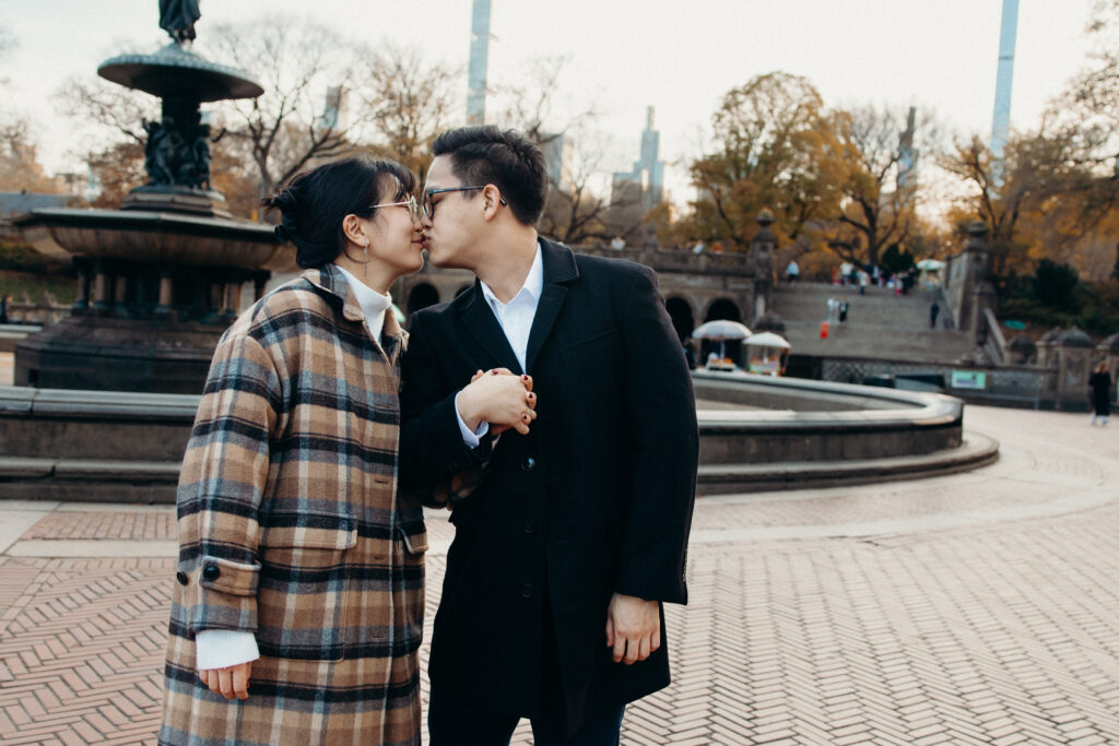 Engaged couple photographed at central park by a brooklyn wedding photographer