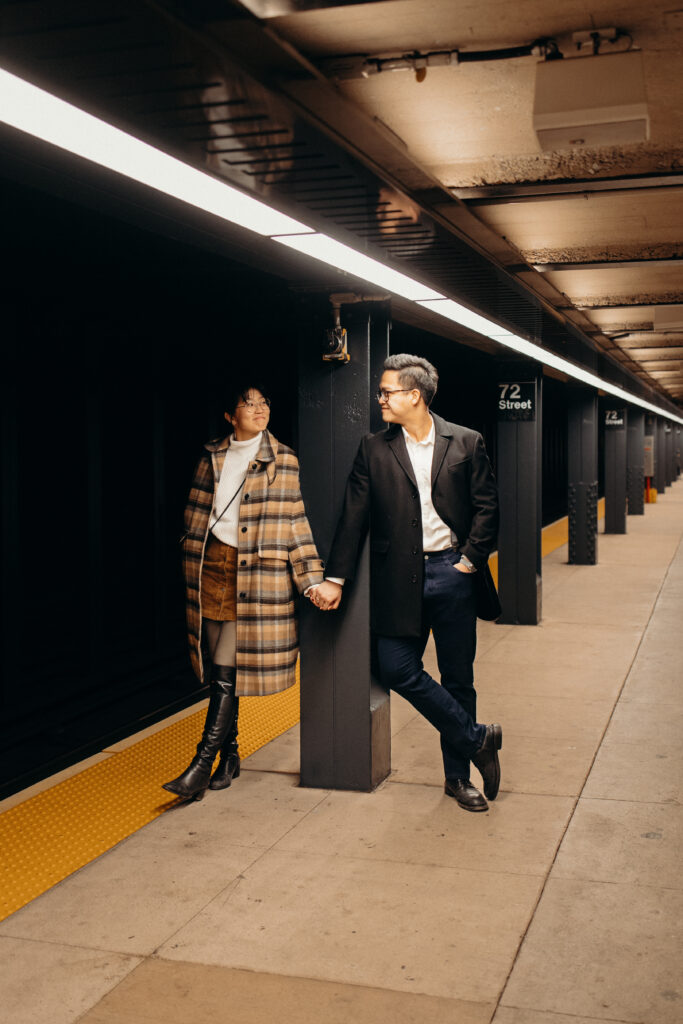 Engaged couple photographed at nyc subway by a brooklyn wedding photographer