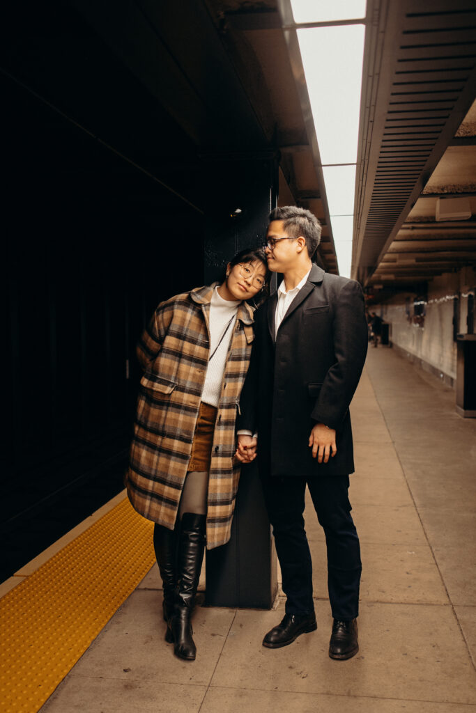 Engaged couple photographed at nyc subway by a brooklyn wedding photographer