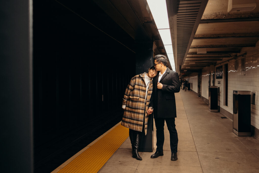 Engaged couple photographed at nyc subway by a brooklyn wedding photographer