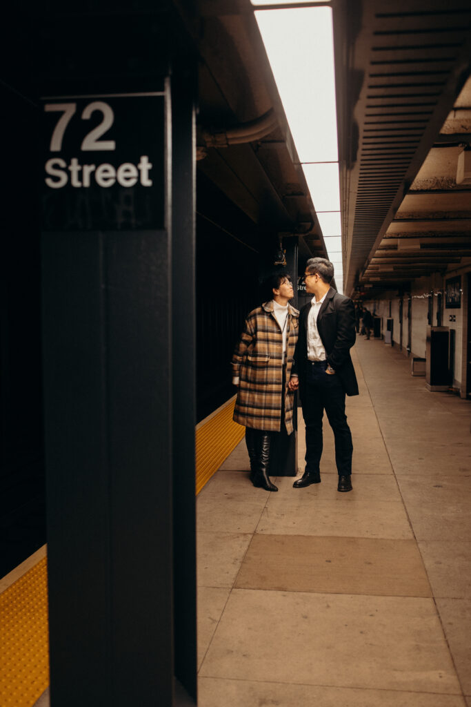 Engaged couple photographed at nyc subway by a brooklyn wedding photographer