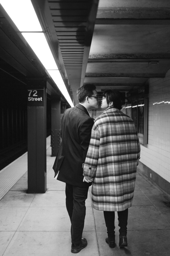 Engaged couple photographed at nyc subway by a brooklyn wedding photographer