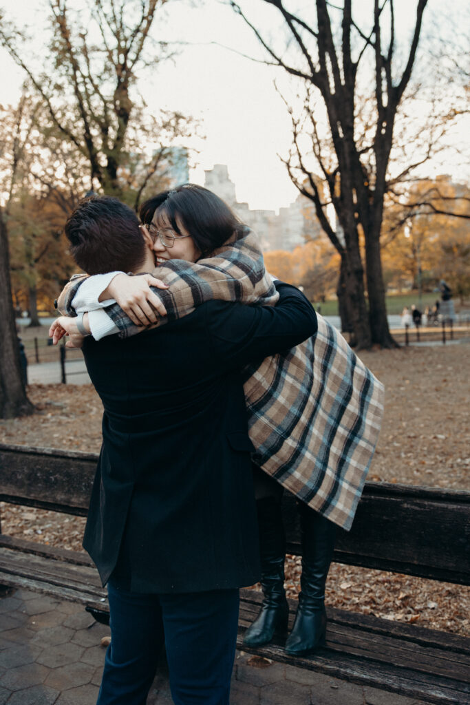 Engaged couple photographed at central park by a brooklyn wedding photographer