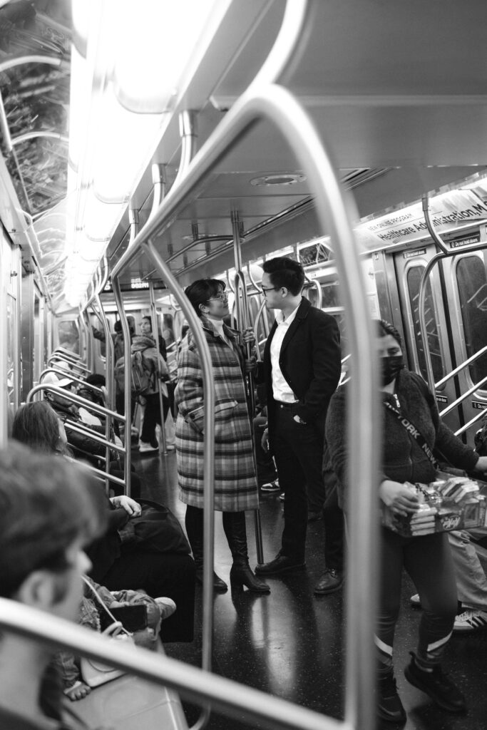 Engaged couple photographed at nyc subway by a brooklyn wedding photographer