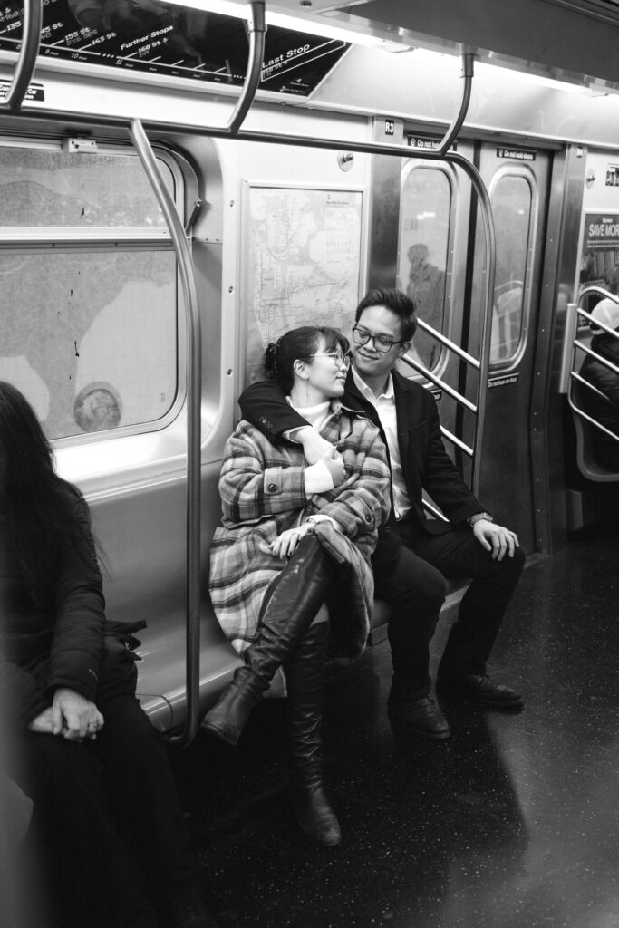 Engaged couple photographed at nyc subway by a brooklyn wedding photographer