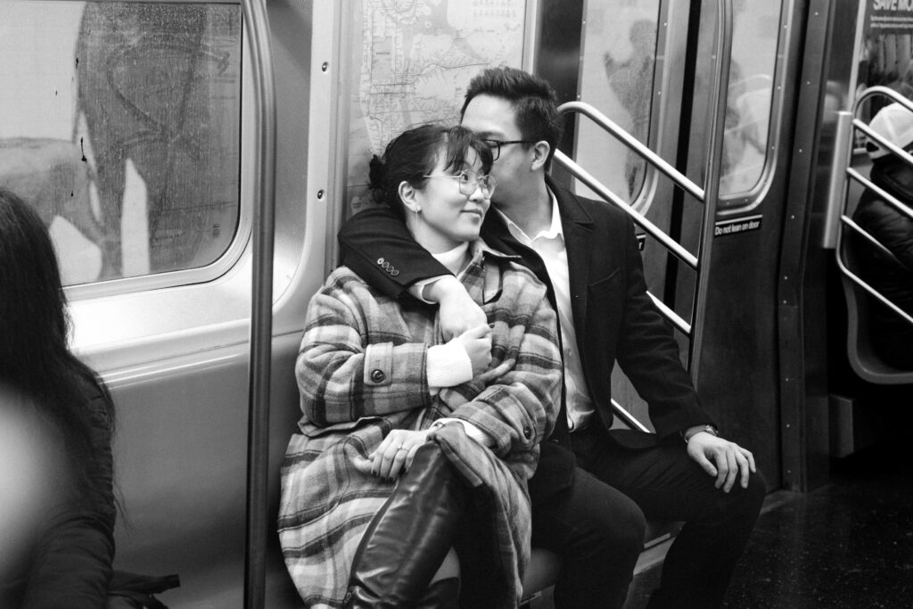 Engaged couple photographed at nyc subway by a brooklyn wedding photographer