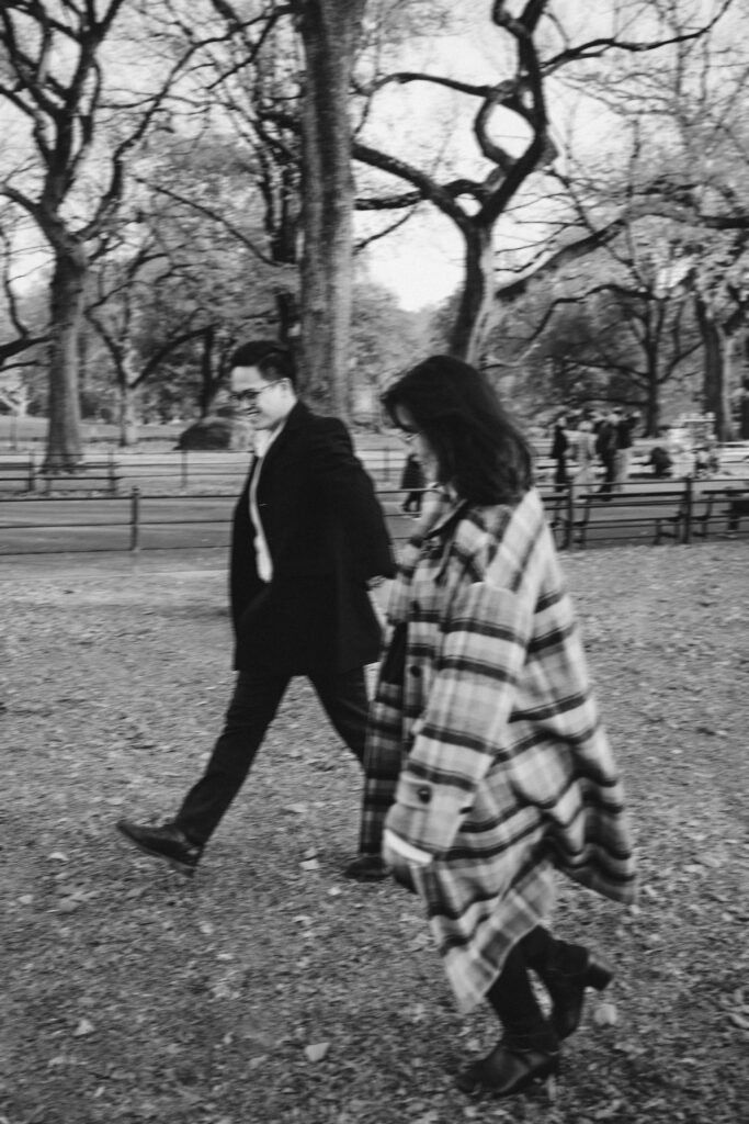 Engaged couple photographed at central park by a brooklyn wedding photographer