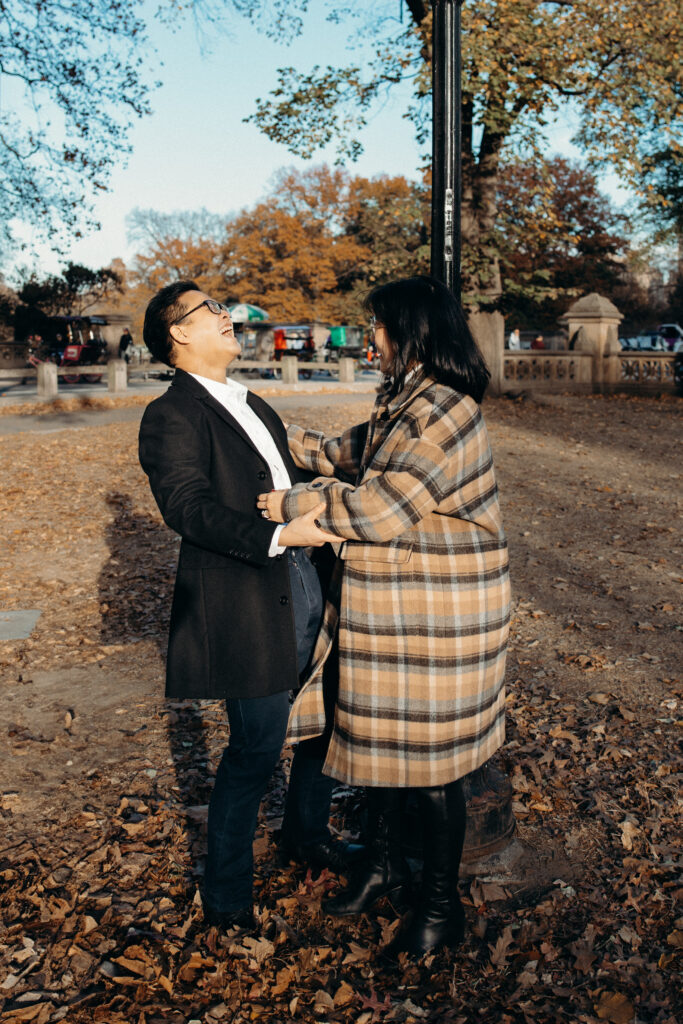 Engaged couple photographed at central park by a brooklyn wedding photographer