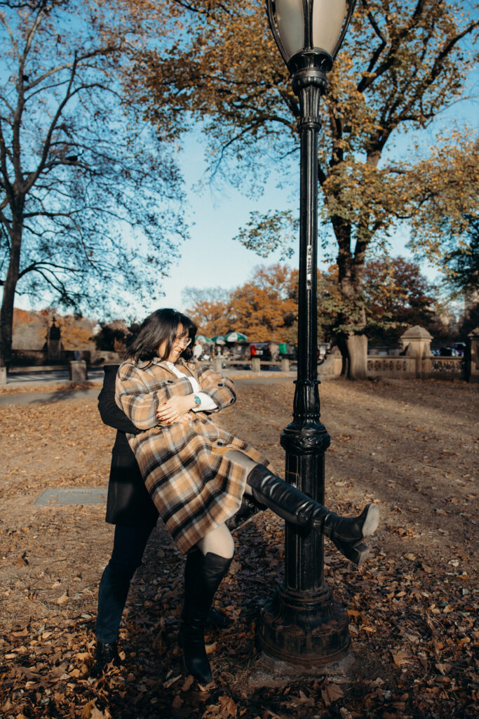 Engaged couple photographed at central park by a brooklyn wedding photographer