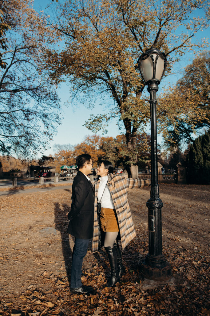 Engaged couple photographed at central park by a brooklyn wedding photographer