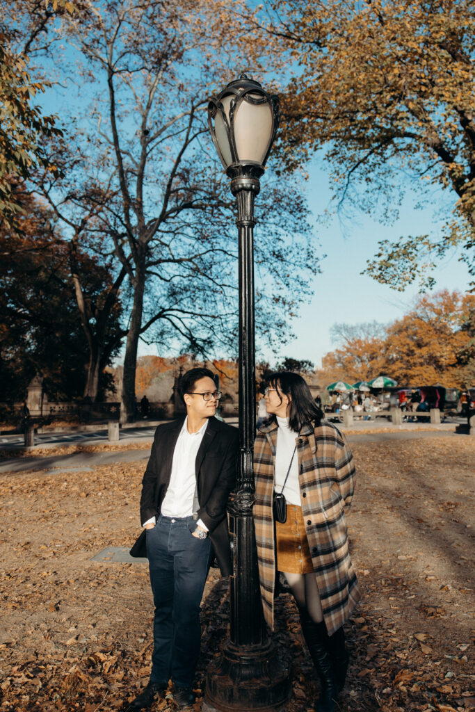 Engaged couple photographed at central park by a brooklyn wedding photographer