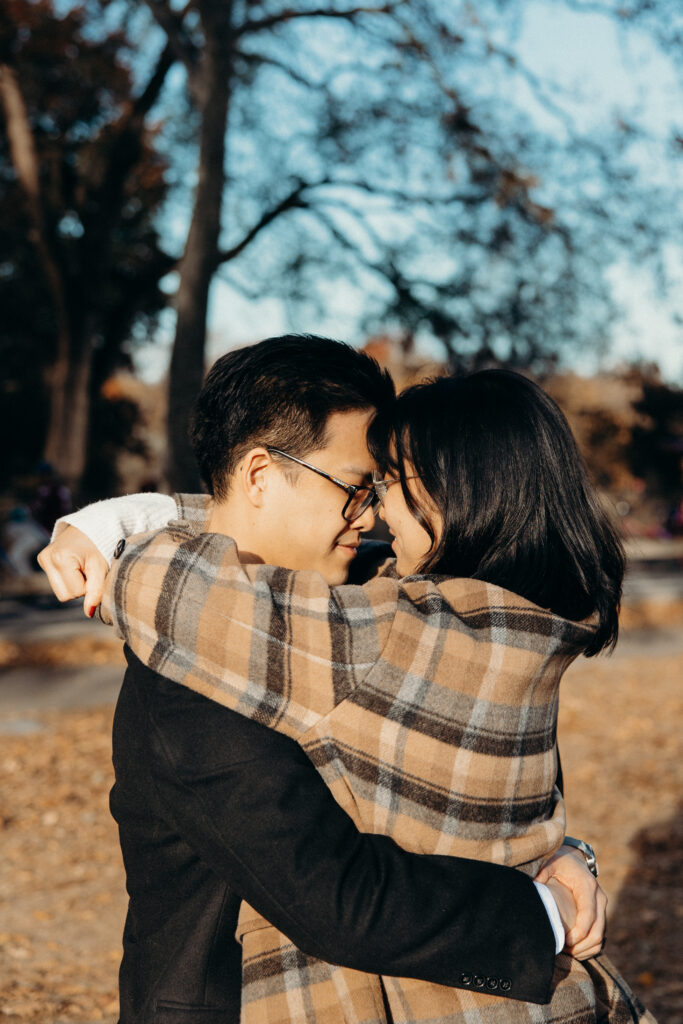 Engaged couple photographed at central park by a brooklyn wedding photographer