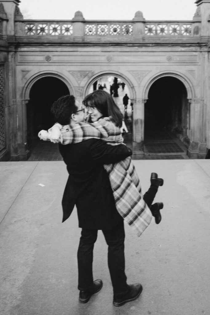 Engaged couple photographed at central park by a brooklyn wedding photographer