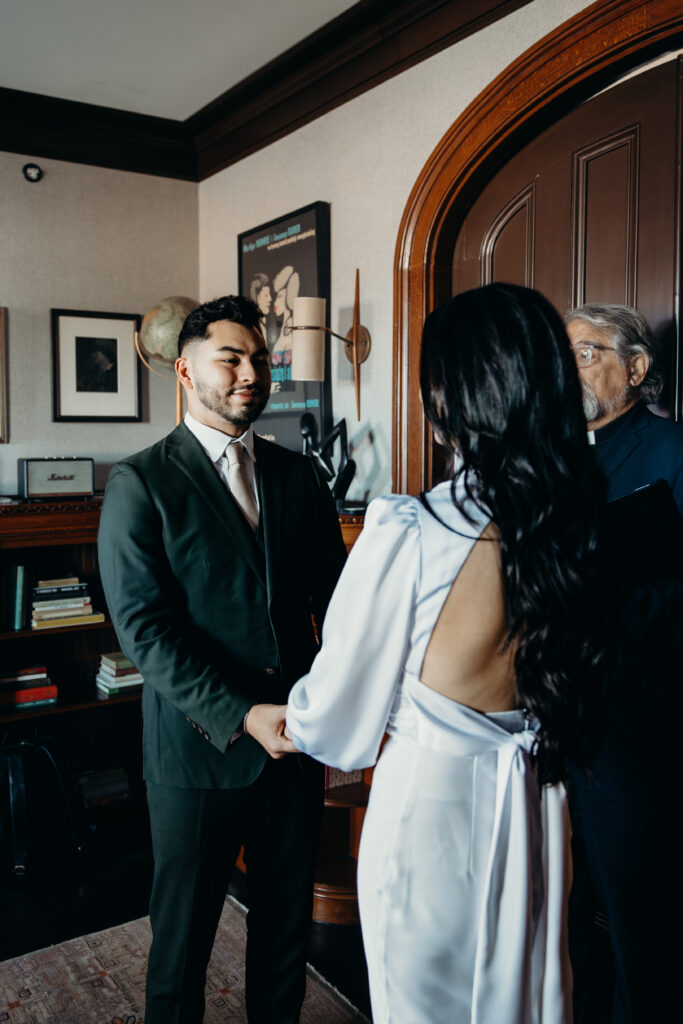 Groom photographed during elopement ceremony at the maker hotel