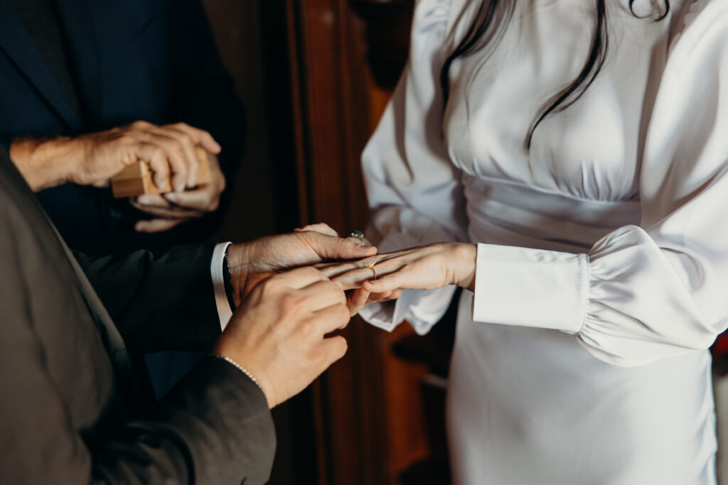 Bride and groom exchange rings at new york elopement venue the maker hotel