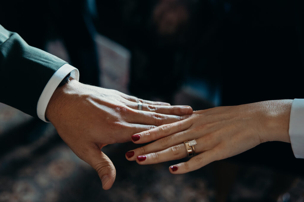 Bride and groom exchange rings at new york elopement venue the maker hotel