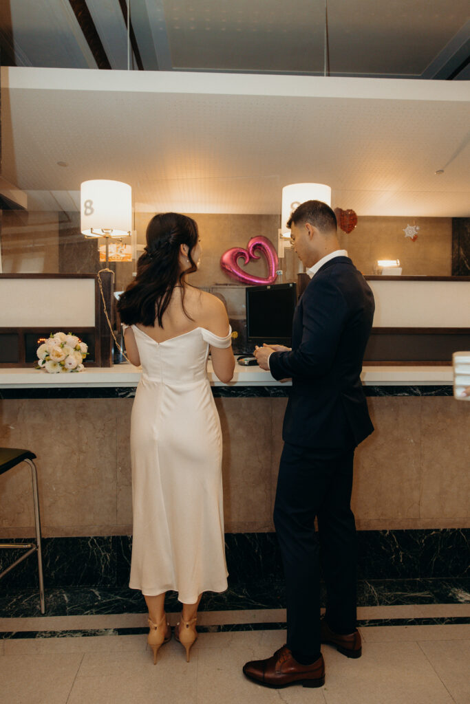 Couple getting ready for their elopement ceremony at nyc city hall