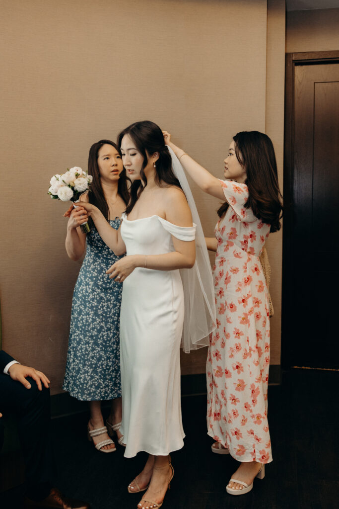 Bride getting ready for their elopement ceremony at nyc city hall