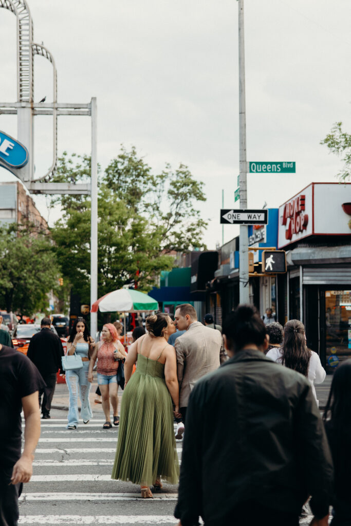 Couple crosses the street during an engagement session in Sunnyside