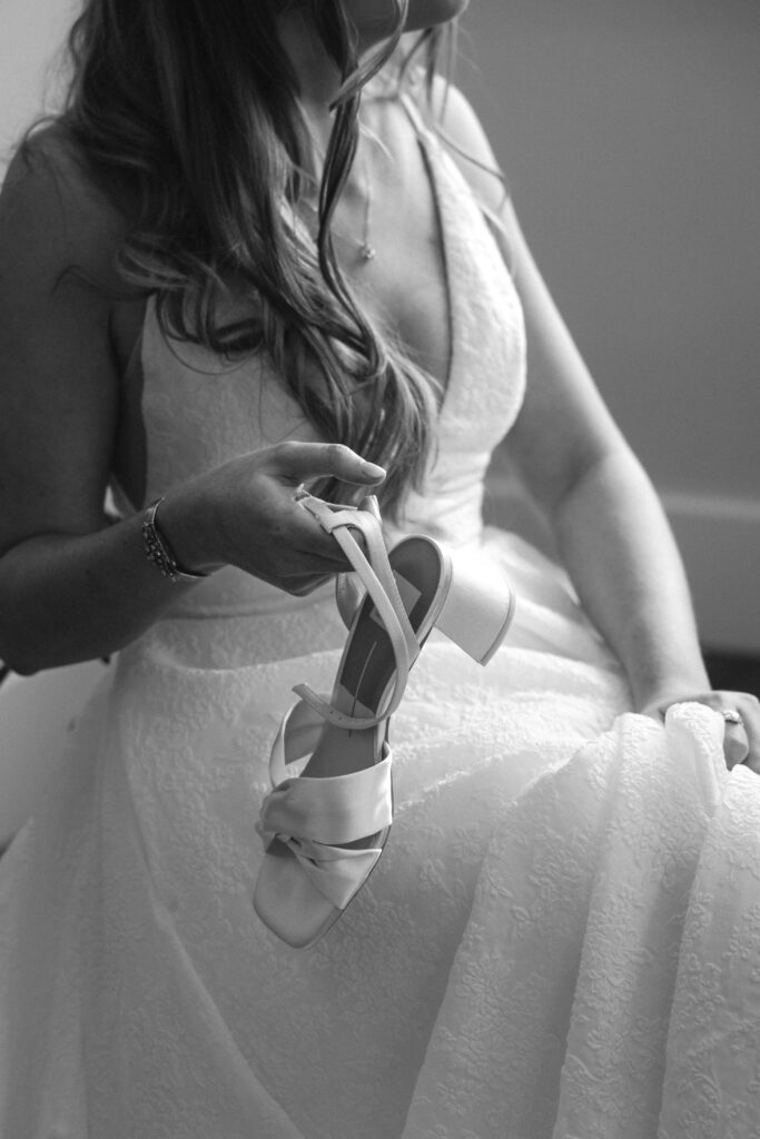 Bride holds shoe at Perona Farms NJ
