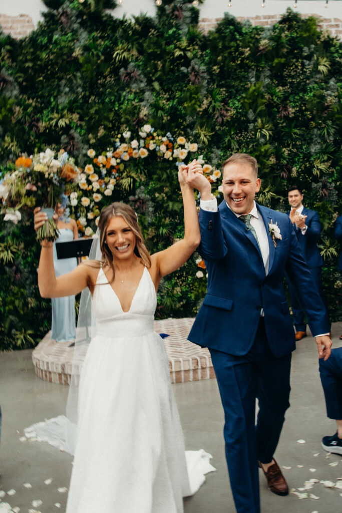 Bride and groom walk down the aisle at Perona Farms NJ