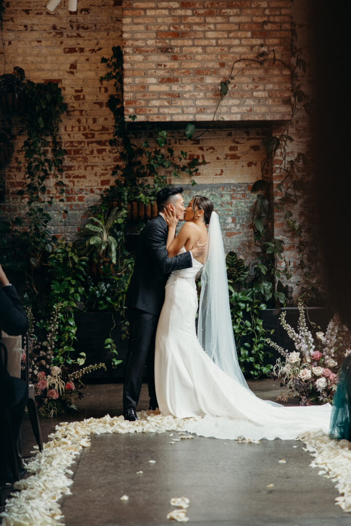 Bride and groom first kiss at Brooklyn Winery