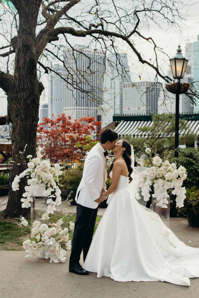 Bride and groom first kiss at The River Café NYC