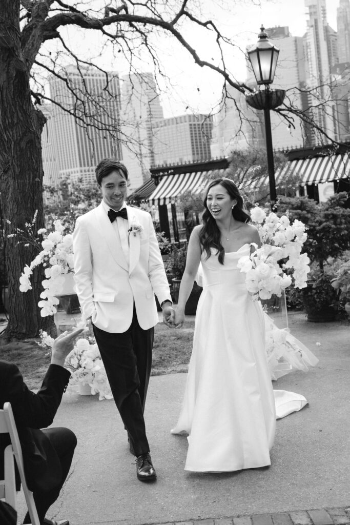 Bride and groom walk down the aisle at The River Café NYC
