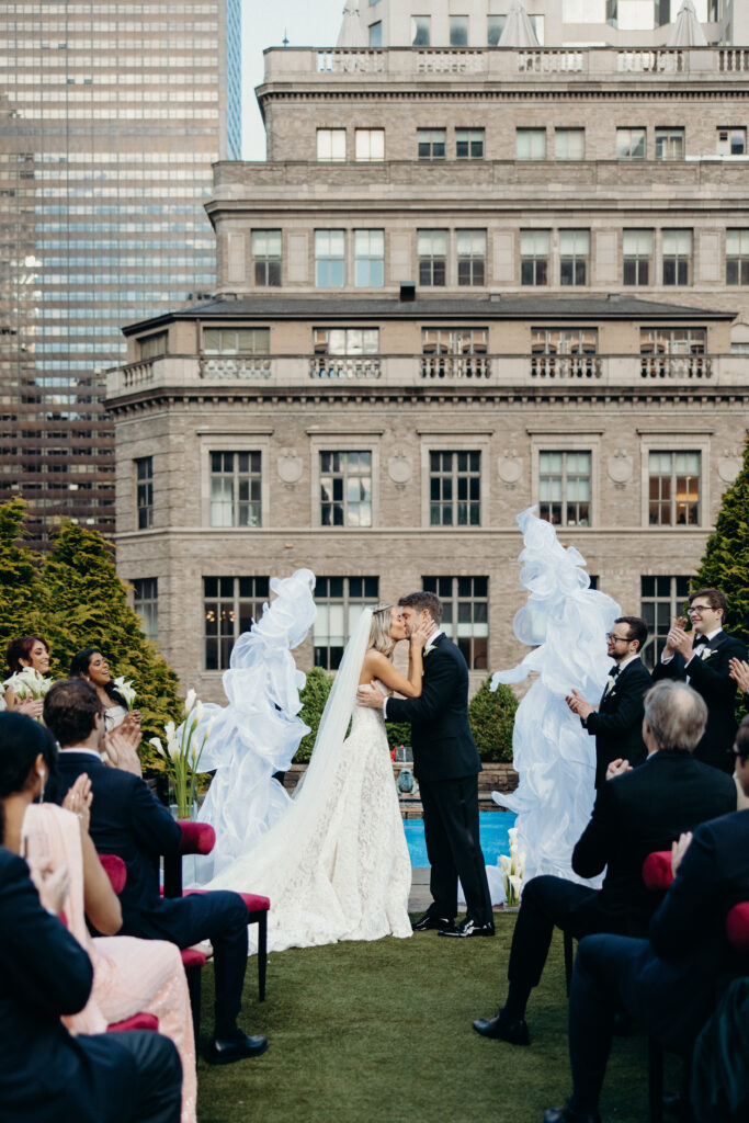 Bride and groom first kiss at 620 Loft & Garden