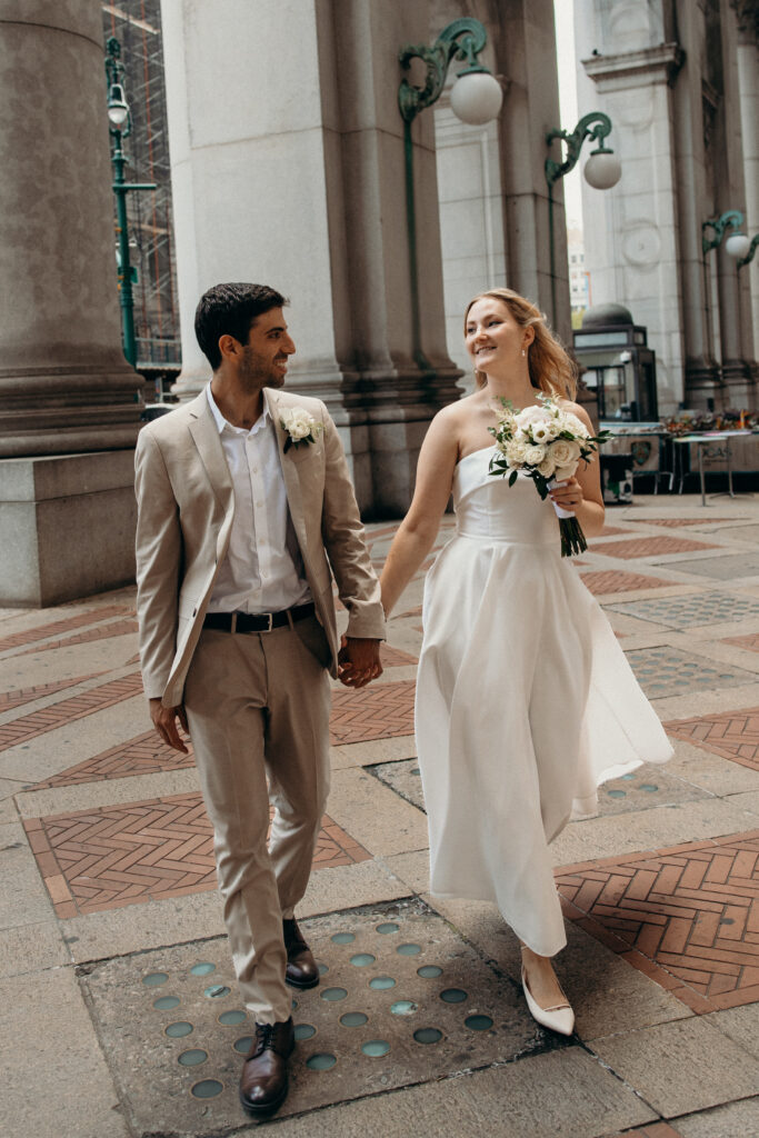 NYC elopement photographer photographing the couple at NYC City Hall