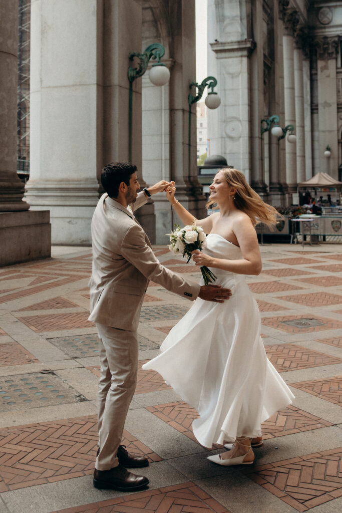 NYC elopement photographer photographing the couple at NYC City Hall