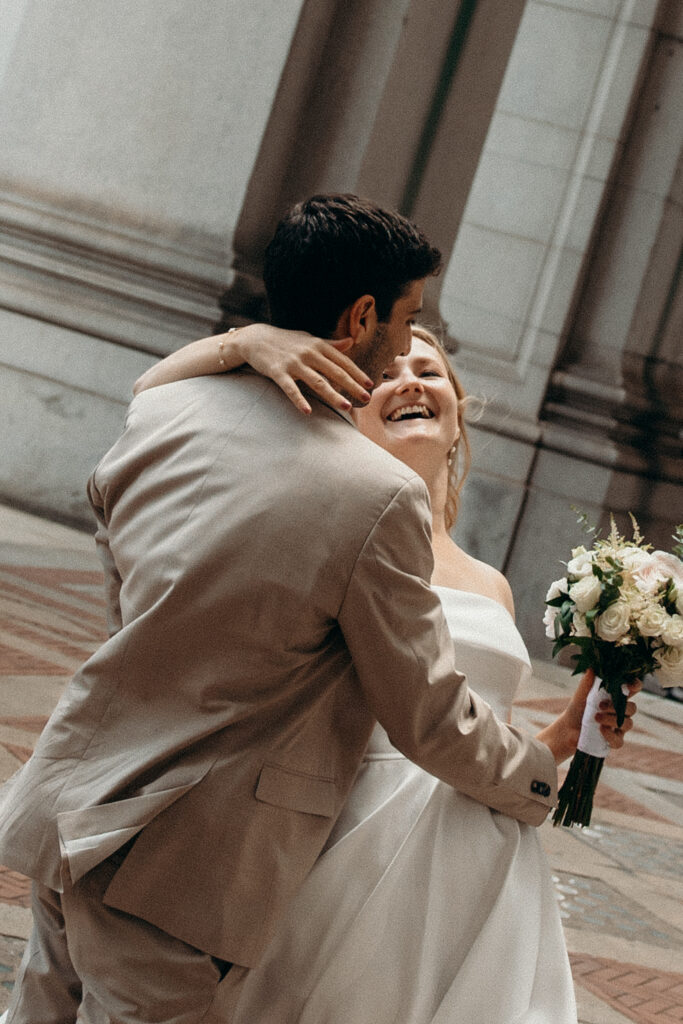 NYC elopement photographer photographing the couple at NYC City Hall