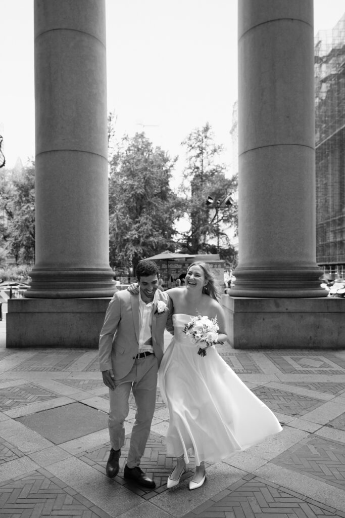 NYC elopement photographer photographing the couple at NYC City Hall