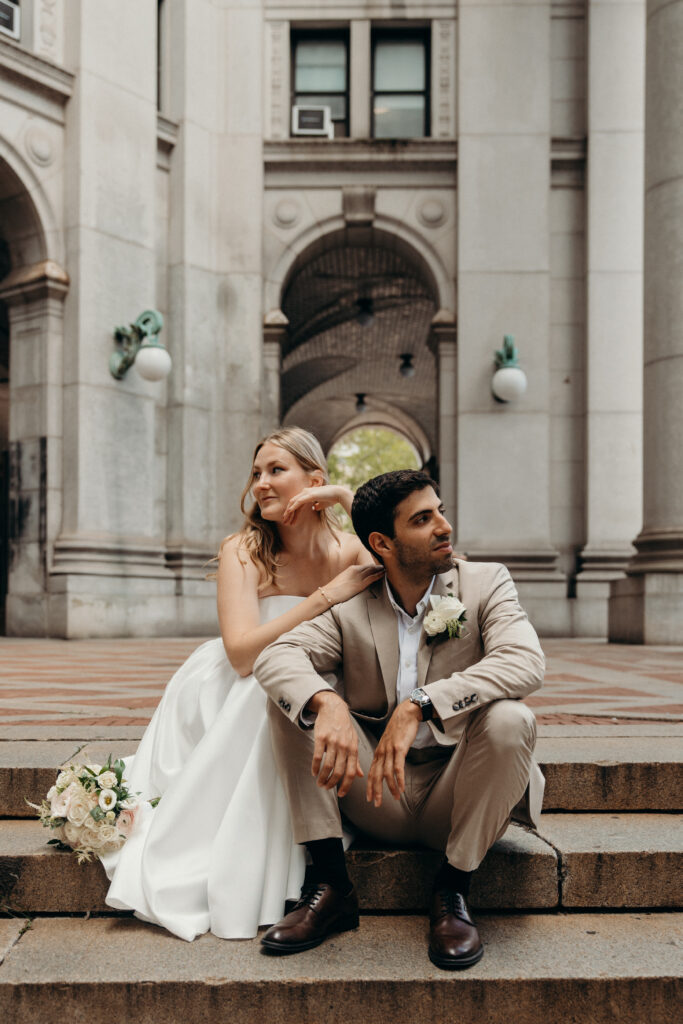 NYC elopement photographer photographing the couple at NYC City Hall