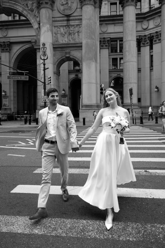 NYC elopement photographer photographing the couple at NYC City Hall