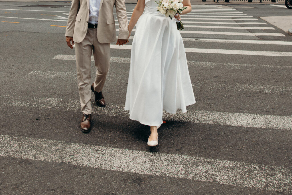 NYC elopement photographer photographing the couple at NYC City Hall