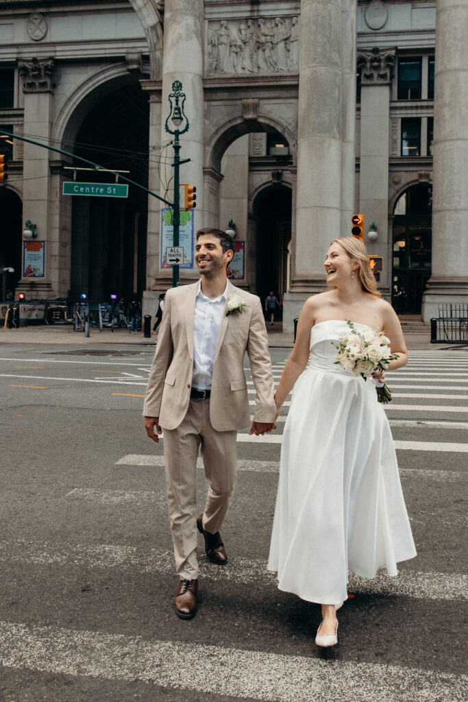 NYC elopement photographer photographing the couple at NYC City Hall