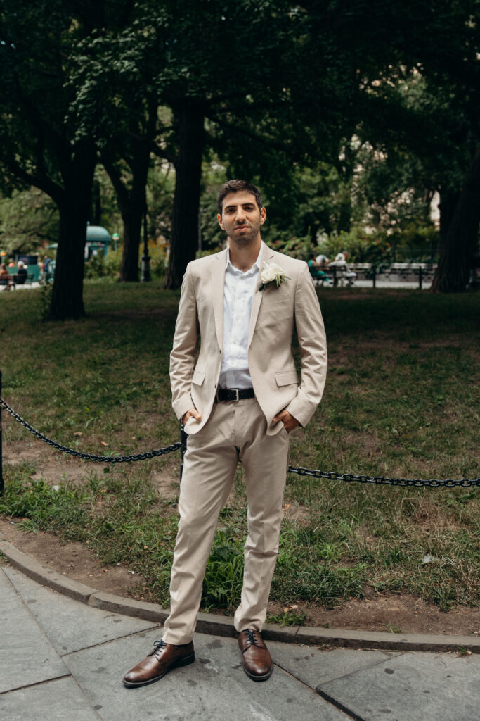 NYC elopement photographer photographing the groom at NYC City Hall